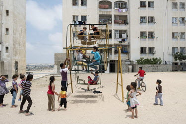 Children play on a decrepit merry-go-round in Bayt Lahiya, a frequent target of airstrikes by Israel.