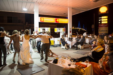 People dancing the traditional Sirtaki at the wedding party of Anna (26) and Christos Karalis (44). Christos, who owns a Shell petrol station in Rio near the port city of Patras, decided to organise t...