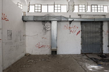 Grafitti in a dormitory in the abandoned detention centre for illegal immigrants in Dikea. The drawings and texts that they left on the walls bear testimony to their frustrations, their homesickness,...