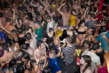 People dance at a water party at the Es Paradis discotheque.