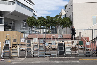 Paparazzi photographers at the 65th Cannes Film Festival have chained step ladders to a fence for use later to look out onto the marina and spot celebrities partying on the yachts. The building behind...