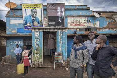 Photographs of 2018 Nobel Peace Prize winner, Dr Denis Mukwege, hang over the entrance to a shop. The gynaecologist and surgeon is famous at home and abroad for his many years of dedication to women w...