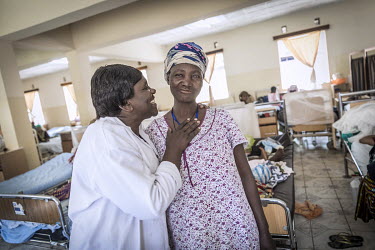 Faila Ethos (60) with Madam Cherie, a social worker at the Panzi hospital. Ethos is recovering at the Panzi hospital where she was admitted earlier this year after being raped by uniformed men in a fi...