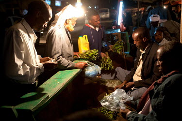 Khat traders at their stall in a khat nightmarket. The khat is imported by truck from Harrare in Ethiopia and it is a big busness, around GBP 157,000 (USD 200,000) is traded each day.