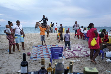 People enjoy a picnic on Elegushi Private Beach.