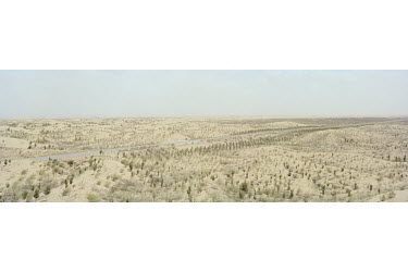 The 'Green Great Wall' and a highway leading to Kubuqi Desert Park.   China has had some success curbing the spread of its deserts, though they are still growing. State Forestry Administration data sh...