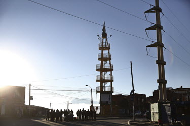 A metal viewing tower rises above El Alto.