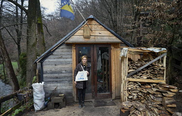 Elma (30) stands in front of the small cottage where women and men guard the entrance to the bridge over the Kruscica River.  They are part of a campaign fighting against plans to construct a hydroele...