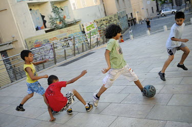 In the evening after the tourists have departed, children reclaim Place des Pistolles, in Le Panier (the basket), to play football.