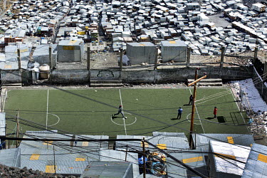 People play football on an articial pitch in La Rinconada, a gold mining town that is the highest permanently settled community in the world (5,200 - 5,600 metres).