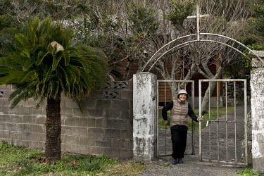 Tsutae Miyagawa (83) stands in front of the Catholic church in Handomari, a small village on Fukue Island. She is the very last parishioner of the church. A priest comes once a month to celebrate a ma...