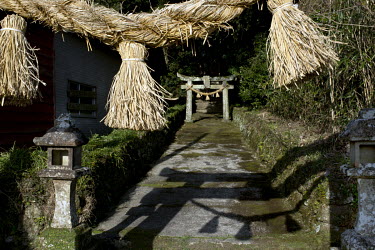 The entrance of a Shinto shrine on Fukue Island.  The severe decline of population on the Goto islands is also affecting places of worship: shrines, temples or churches are often neglected or abandone...