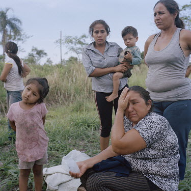 Maria Lina Estorales cries while explaining how she and the other 21 families of the small community of Guayaqui Cua were evicted and their properties burned just two days earlier. She stated that sec...