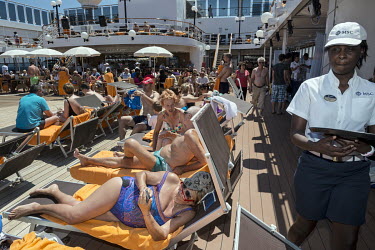 Passengers sunbathing onboard of the MSC Lirica, a cruise ship belonging to the Mediterranean Shipping Company.