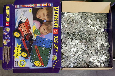 A box containing parts used in 'Merkur' (Mercury) construction toy sets at the company factory.