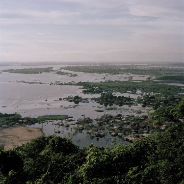 A view from Cerro Lambare, a hill in the capital, of houses flooded by the Paraguay River. The flooding has been caused by heavy rainfall, due to the El Nino phenomenon, and massive deforestation for...