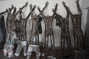 A group of artist Freddy Tsimba's statues made from spoons. He says he finds his inspiration in the suffering experienced by many communities in his country. An advocate for disarmament, much of his a...