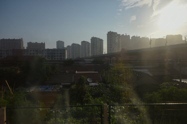 The landscape seen through a window of the K27 international express train travelling from Beijing to Pyongyang.