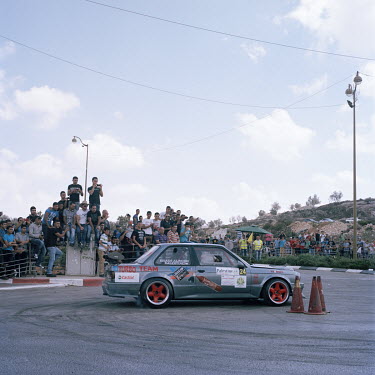 A street race during a gathering of car aficionados' where Palestinians from all over the West Bank, as well as from Israel, meet to show off their cars.