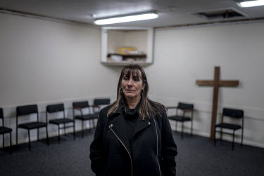 Human rights activist Bernadette O'Rawe in the room that she used as a meeting place for survivors of 'punishment' attacks in the Ballymurphy area of West Belfast.