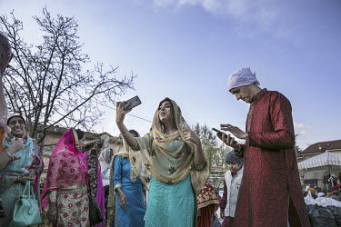 A woman takes a selfie as around 12,000 Sikh migrants, and their Italian born children, representing the Sikh community of the Po Valley and beyond, gather at the Gurdwara Singh Sabha Sikh temple for...