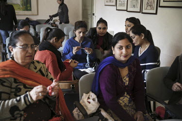 Sikh migrant women gather for Italian lessons which are provided by the mayor's office.