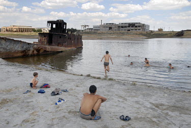 A group od boys swimming near a shipwreck in the town's former port. The Aral Sea, once the world's fourth largest lake, gradually disappeared following the decision in the 1960s by Soviet planners to...