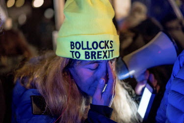 An anti-Brexit protestor, wearing a hat with the slogan 'Bollocks to Brexit', in Parliament Square on the day of the second meaningful vote on Prime Minister Theresa May's Brexit deal.