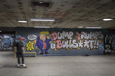 Anti-Trump graffiti on the walls of the Undercroft skate park on the South Bank of the Thames River.