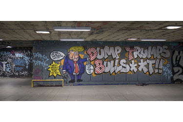 Anti-Trump graffiti on the walls of the Undercroft skate park on the South Bank of the Thames River.