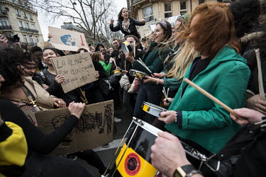 A group of students banging drums as they make their way through the city centre during a 'climate strike' demonstration. Joining the worldwide #ClimateStrike #FridaysForFuture youth movement, inspire...