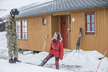 Pilot luitenant Ben Lilley talking to volunteer Kaisa-Wenche Vivisdatter while on a mission to transport firewood to a remote Norwegian cabin, the newly built Vouma cabin in the Dividalen National Par...