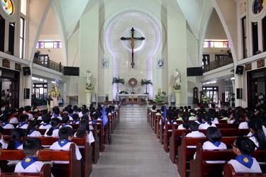 Children attend Sunday Mass at a Catholic church.