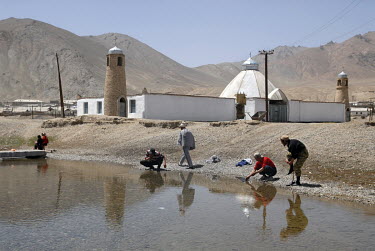 Men washing their hands and feet in the river before Friday prayers in the mosque in the ethnic Kyrgyz town of Murgab.