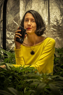 Carola Perez, President of the Spanish Medicinal Cannabis Observatory, using a vaporiser to inhale medical cannabis for therapeutic use at her cannabis cultivation facility. She has undergone eleven o...