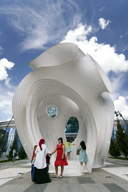 People visit 'Minima | Maxima' a large public art sculpture by Marc Fornes/Thevery in the grounds of the World Expo 2017.