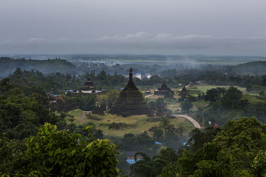 Mists rise near temples, constructed during the era of the Kingdom of Arakan, early in the morning.