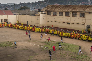 A football match played at Luzira Prison between teams composed of inmates, Liverpool in black versus Manchester United in Red. A league, made up of several sides named after UK Premier League sides,...