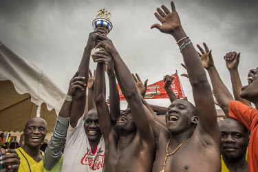 Players celebrate following a football match played at Luzira Prison between teams composed of inmates, named Liverpool and Manchester United. A league, made up of several sides named after UK Premier...