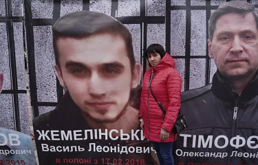 Zhemelinska Larisa Vasilovna stands in front of a photo of her son, a military intelligence officer, who was captured and imprisoned by rebels in eastern Ukraine in February 2018.