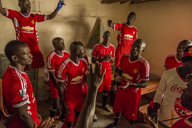 Players from a team named after Manchester United prepare for their final at Luzira Prison where a league, made up of several sides named after UK Premier League sides, operates throughout the year. T...