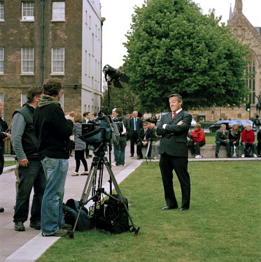 An American journalist and televison crew film a report on College Green on the day Gordon Brown succeeded Tony Blair as Britain's Prime Minister. Often referred to as College Green, Abingdon Street G...