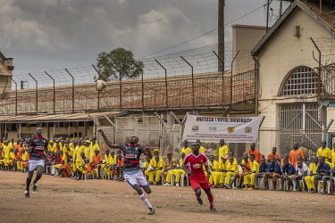 A football match played at Luzira Prison between teams composed of inmates, Liverpool in black versus Manchester United in Red. A league, made up of several sides named after UK Premier League sides,...