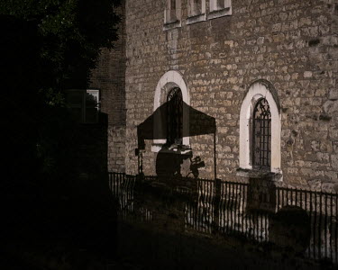 The shadow of a television falls on a building beside College Green as the media cover a tense Parliamentary session as MPs discussed the Prime Minister's Brexit deal in the nearby House of Commons. T...