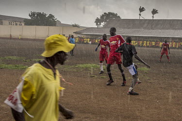 A match played in the rain at Luzira Prison between teams composed of inmates, Liverpool in black versus Manchester United in Red. A league, made up of several sides named after UK Premier League side...