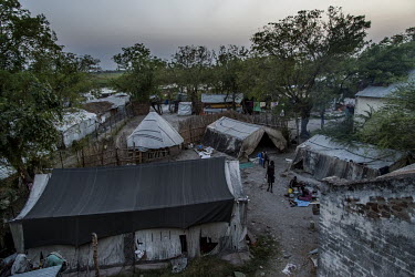 Shelters, in the medical clinic's compound, housing families of internally displaced people who have fled fighting.