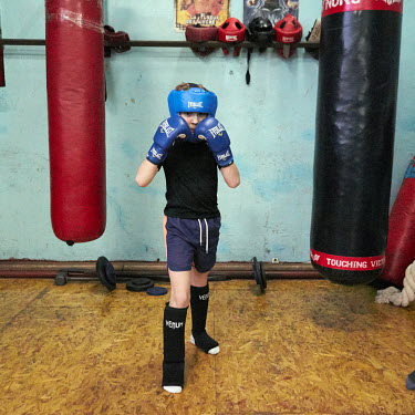 A boy at a Thai boxing training session.