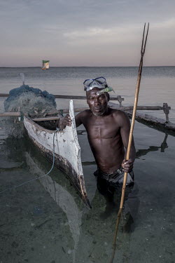 Spearfisherman Jean de Dieu Ronde (51) with his spear in the village of Tampolove in the Bay of Assassins. [This photo story was shot as a collaboration between Tommy Trenchard and Aurelie Marrier d'U...