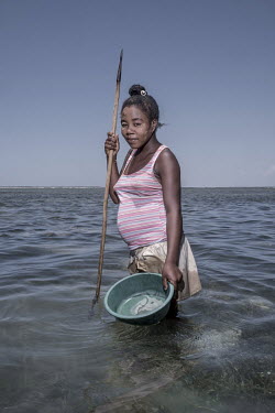 18 year old Sahundra, in the sea near Tampolove where she hunts for octopus. The community's regular closures of octopus fisheries have significantly increased the size of her catches. [This photo sto...
