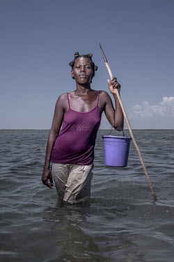 Irene (25) has been hunting octopus since she was 12 years old. She says after the community began closing octopus fishing grounds her catches, when they reopened, became significantly larger. [This p...